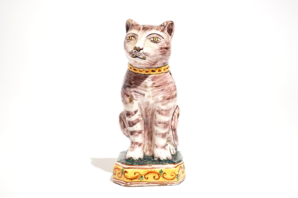 A polychrome Dutch Delft model of a cat, 19th C.