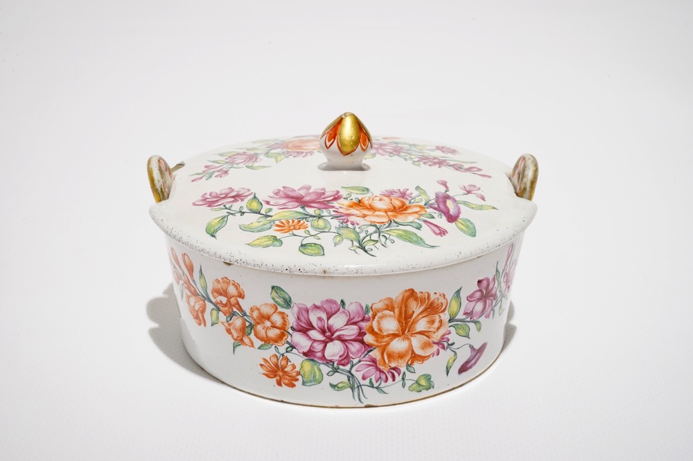A Dutch Delft petit feu polychrome butter tub and cover with floral design, 18th C.