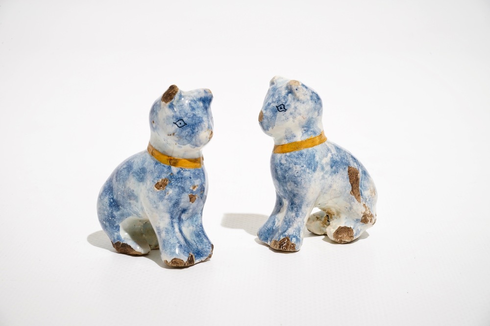 A pair of small polychrome Dutch Delft models of cats, 18th C.
