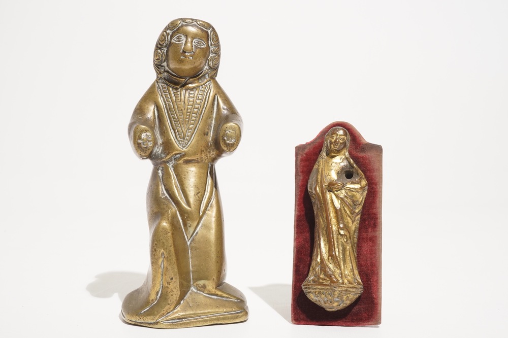 A small gilt bronze model of a Virgin and a bronze luster ornament shaped as a saint, 13/15th C.