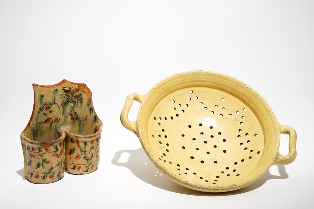 A French stoneware strainer and a wall hanger for cutlery, Aiglefontaine, 18th C.