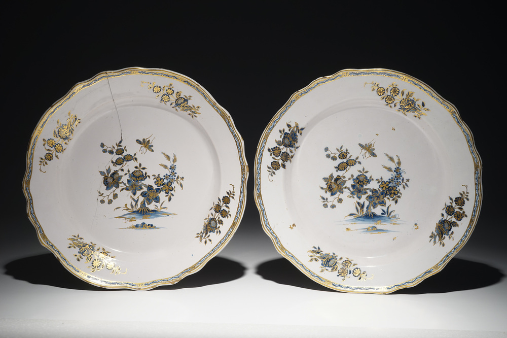 A pair of gilt-decorated blue and white Tournai faience dishes, 18th C.