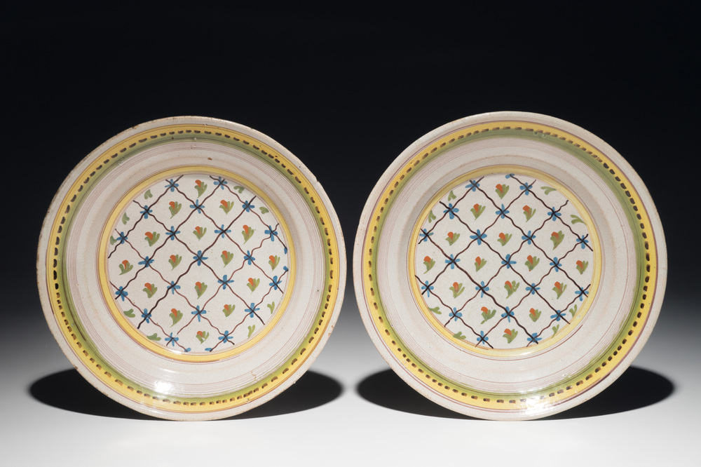 A pair of polychrome Brussels faience plates, 1st half 19th C.