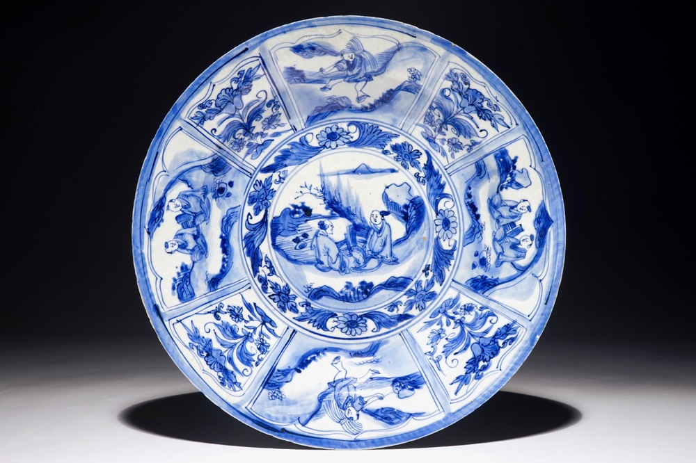 A Chinese blue and white dish with figures in a landscape, Transitional period