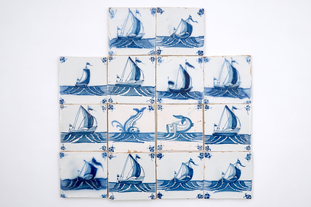 14 blue and white Delft tiles with boats and sea creatures, 18th C.