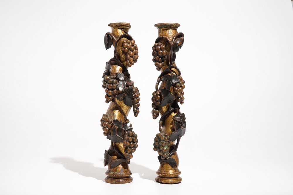 A pair of pillars with grapes, carved wood with gilding and polychromy, 18th C.