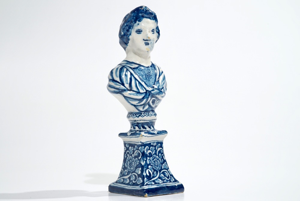 A Dutch Delft blue and white bust on stand, 17/18th C.