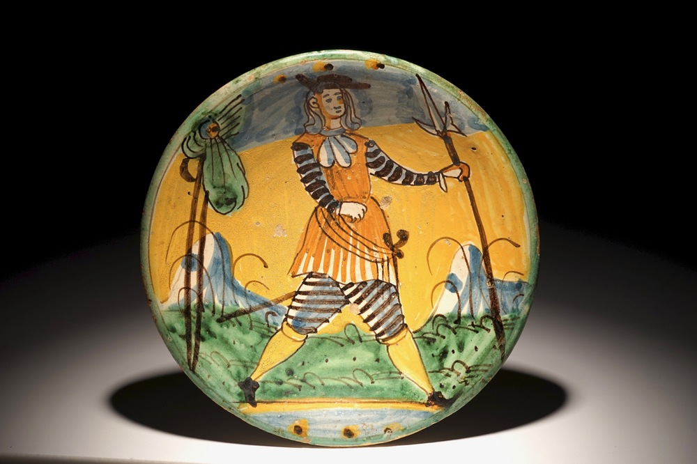 A polychrome Italian maiolica dish with a soldier, Montelupo, 17th C.