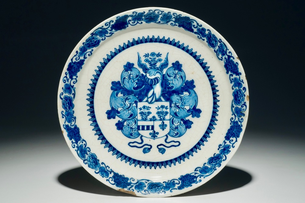 A Dutch Delft blue and white armorial plate, 1st half 18th C.