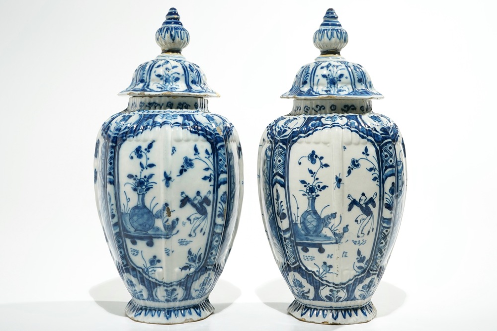 A pair of Dutch Delft blue and white chinoiserie covered vases, 18th C.