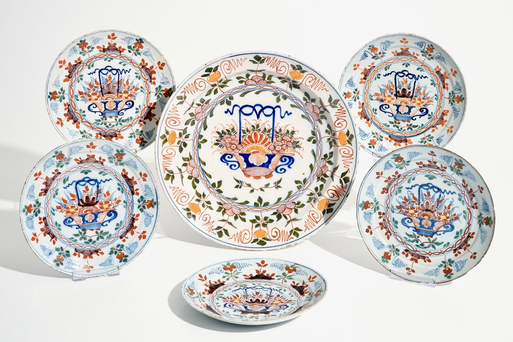 Five polychrome Dutch Delft plates and a dish with flowerbaskets, 18th C.