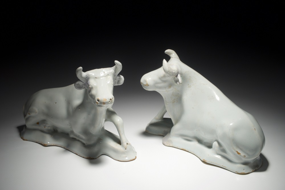 A pair of white Dutch Delft resting cows, 18th C.