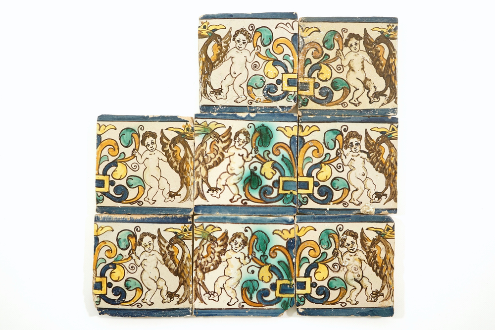 Eight Spanish or Portuguese tiles with putti and crowned eagles, 17th C.