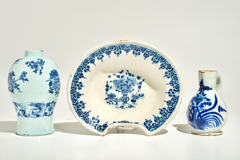 A blue and white French faience shaving bowl, a chinoiserie vase and a jug, Nevers and Moustiers, 17/18th C.