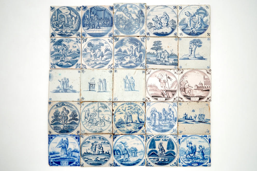A field of 25 Dutch Delft blue and white and manganese tiles with religious scenes, 18th C.