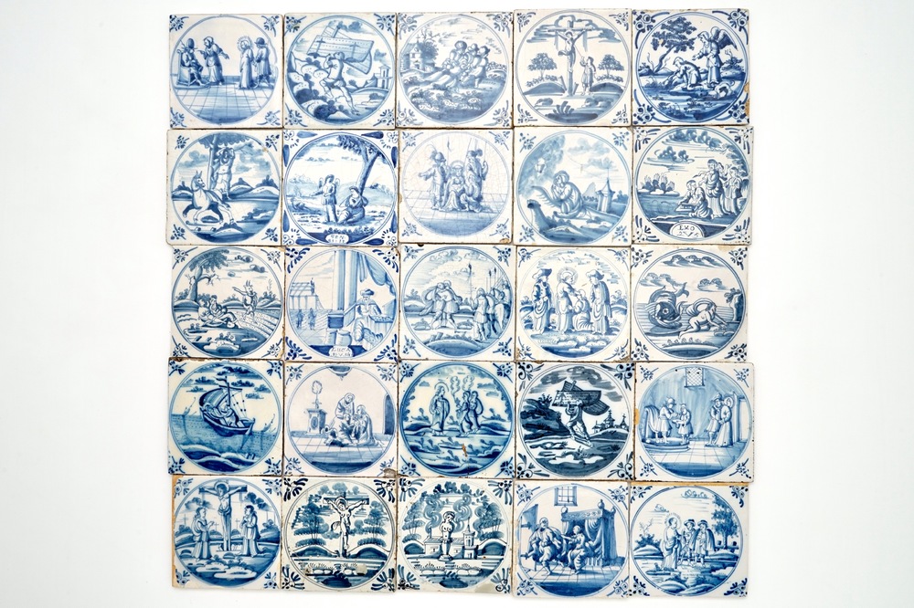 A field of 25 Dutch Delft blue and white tiles with religious scenes in central medallions, 18th C.