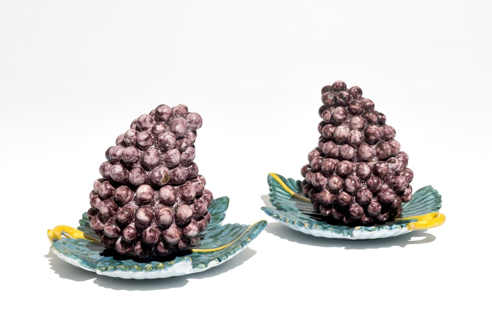 A pair of polychrome Dutch Delft tureens modelled as grapes, 18th C.