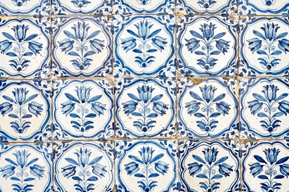 A field of 41 Dutch Delft blue and white tiles with three-tulip design, 17th C.