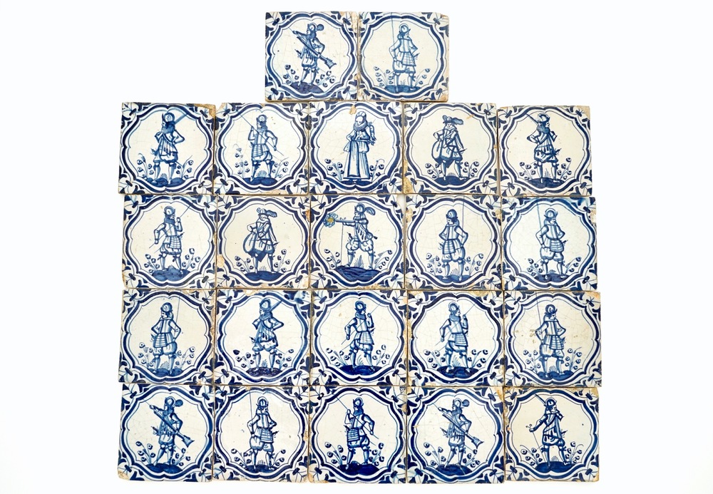 A field of 22 Dutch Delft blue and white tiles with soldiers after Jacob de Gheyn, 17th C.