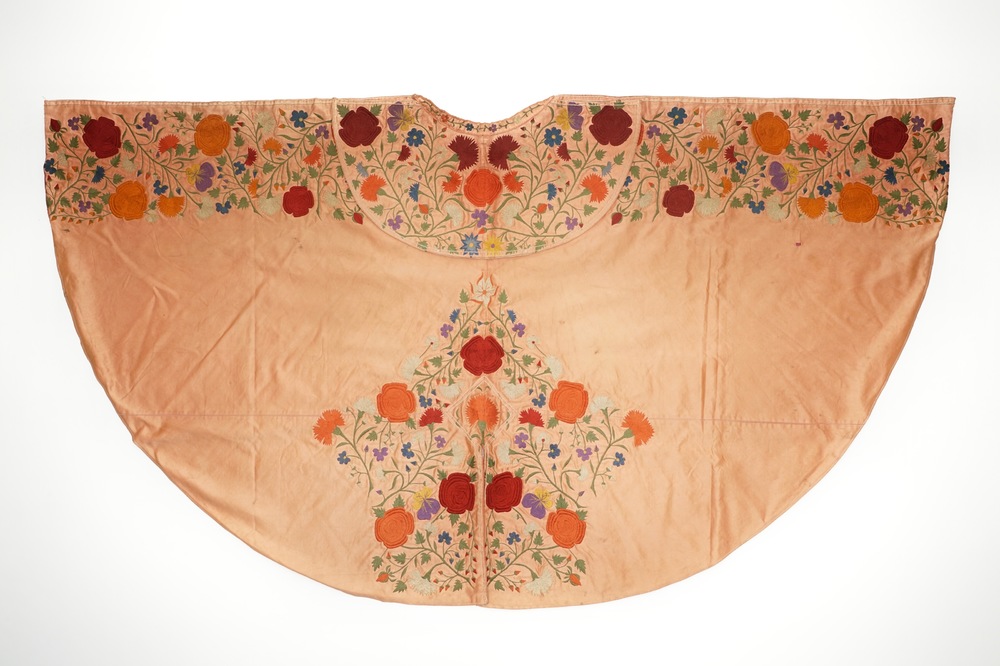 A salmon silk matador cape with embroidered floral design, Spain, 1st half 20th C.