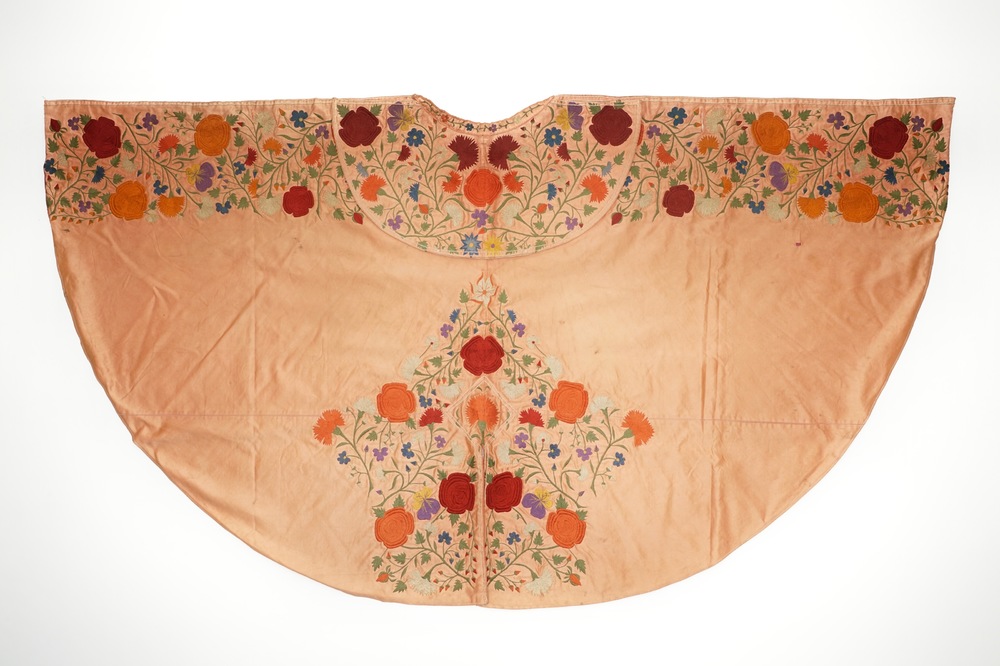 A salmon silk matador cape with embroidered floral design, Spain, 1st half 20th C.