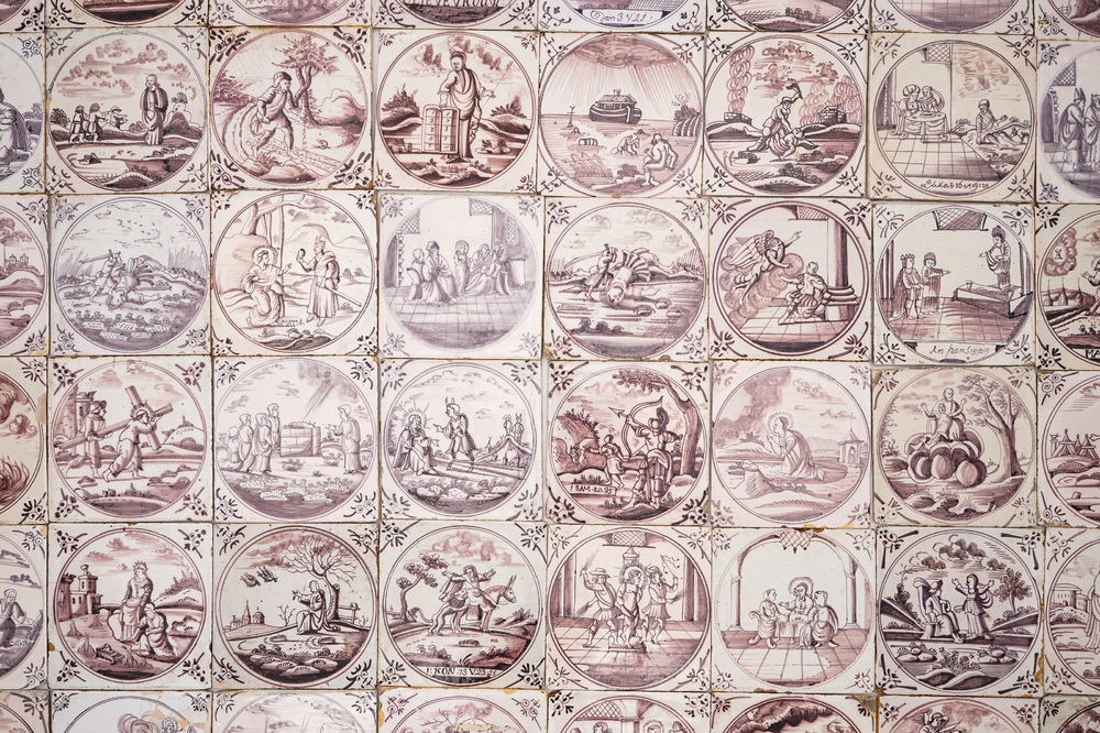 A field of 64 Dutch Delft manganese tiles with religious scenes in central medallions, 18th C.