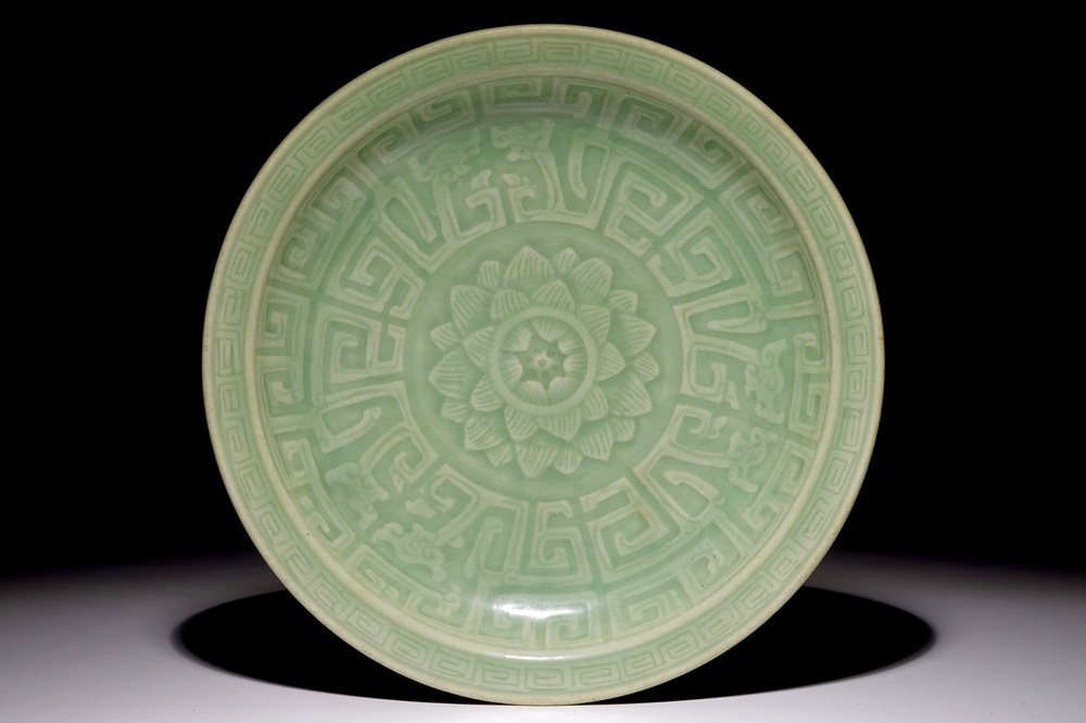 A Chinese celadon dish with incised lotus design, 18/19th C.