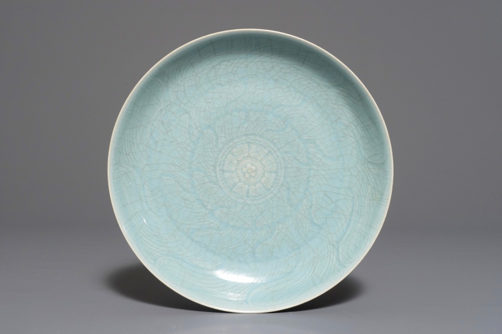 A monochrome Chinese clair-de-lune glazed dish with incised lotus design, 19/20th C.