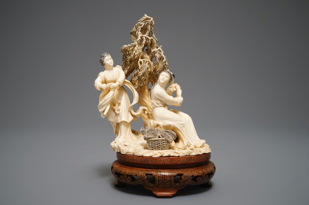 A Chinese carved ivory group of two ladies on inlaid wooden base, 1st half 20th C.