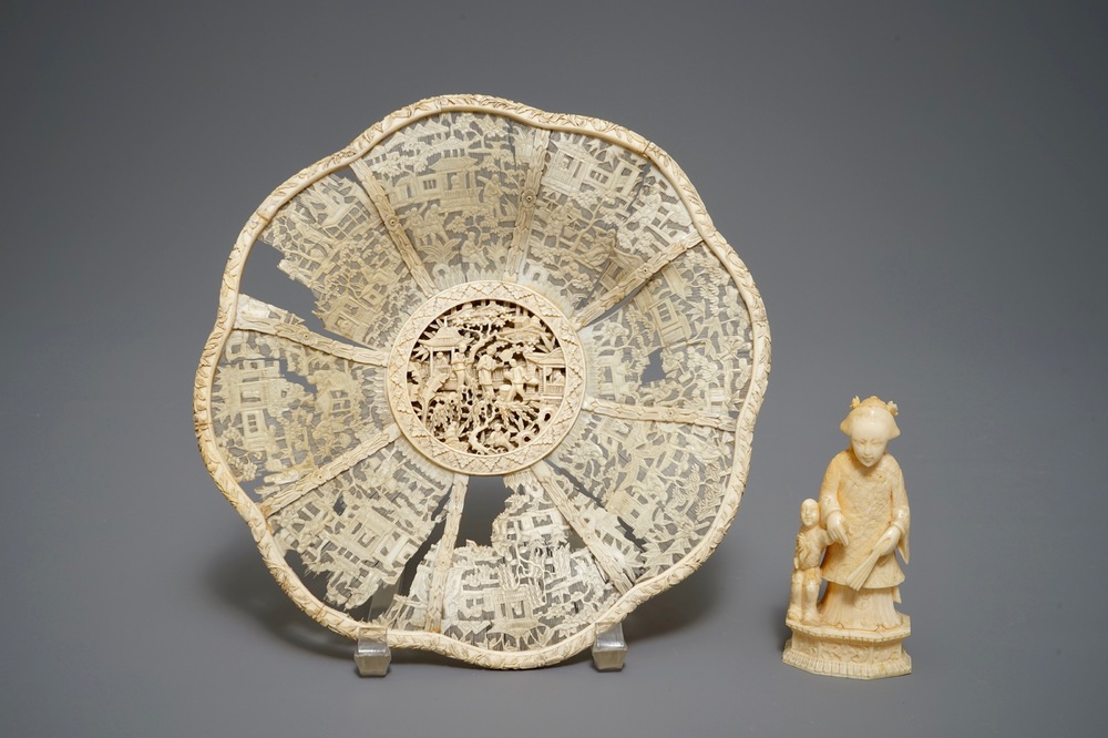 A Chinese pierced ivory basket and a small group of a lady with child, 19th C.