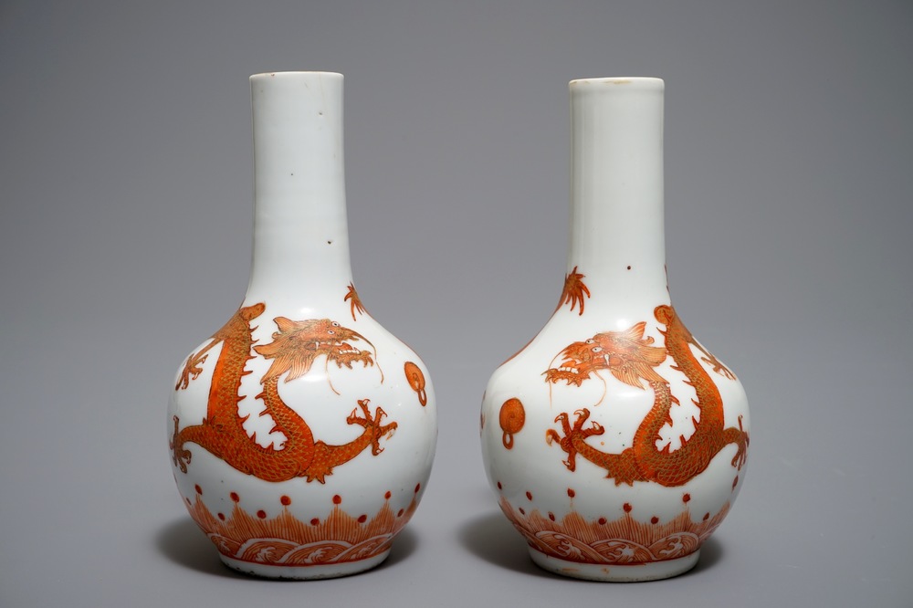 A pair of Chinese iron red and gilt bottle vases with dragons, Wanli mark, 19th C.