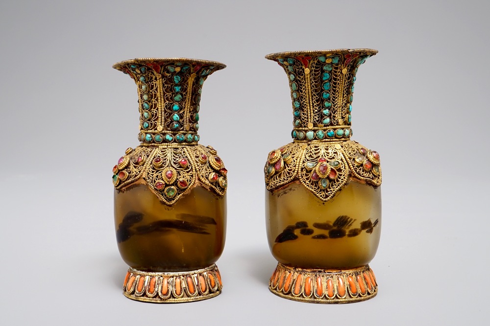 A pair of Tibetan agate flasks with turquoise- and coral-inlaid gilt silver mounts, 19th C.