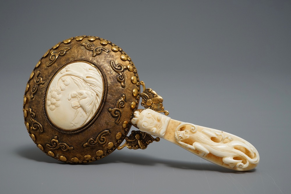 A Chinese gilt brass and ivory mirror, 19th C.