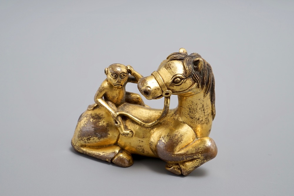 An inscribed Chinese gilt bronze model of a monkey on a horse, 19/20th C.