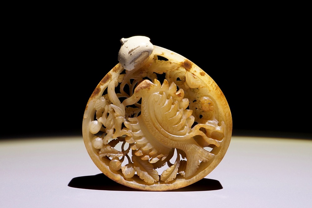 A Chinese reticulated mottled jade phoenix plaque, Ming or earlier