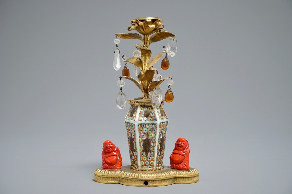 A small lamp composed of Chinese porcelain, coral, rock crystal and amber in a French gilt bronze mount, 19/20th C.
