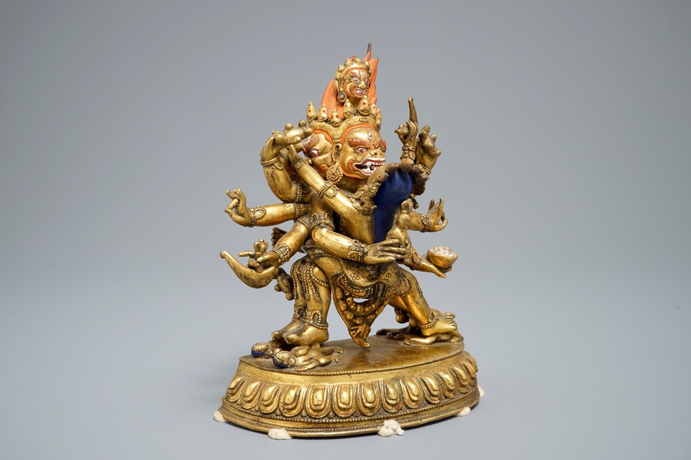 A Sino-Tibetan gilt bronze figure of Mahakala and his consort Yab-Yum, 19/20th C.