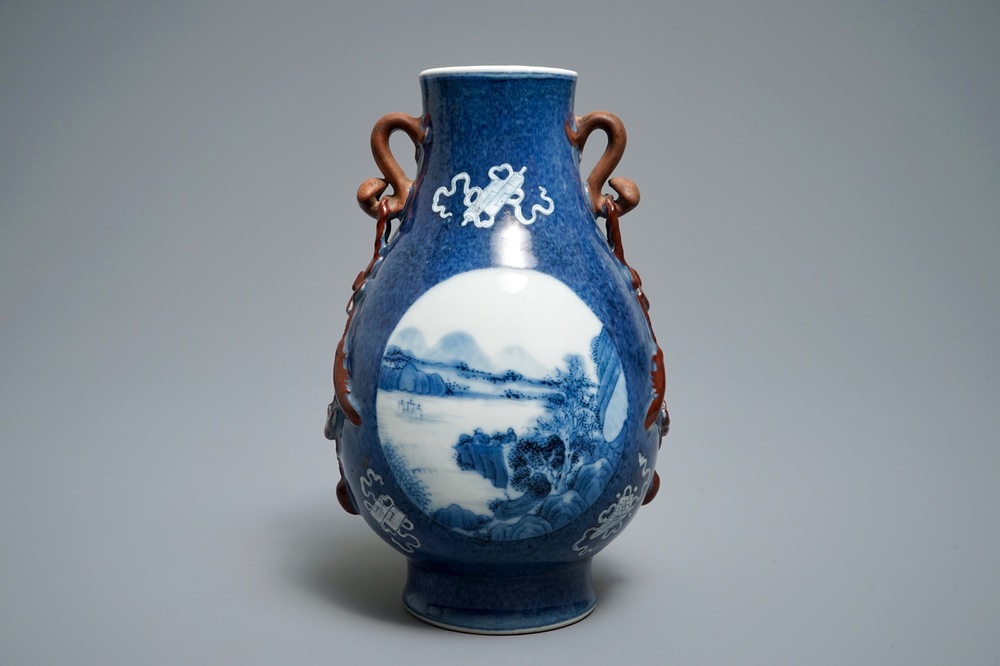 A Chinese blue and white powder blue-ground hu vase with landscape medallions, 19/20th C.