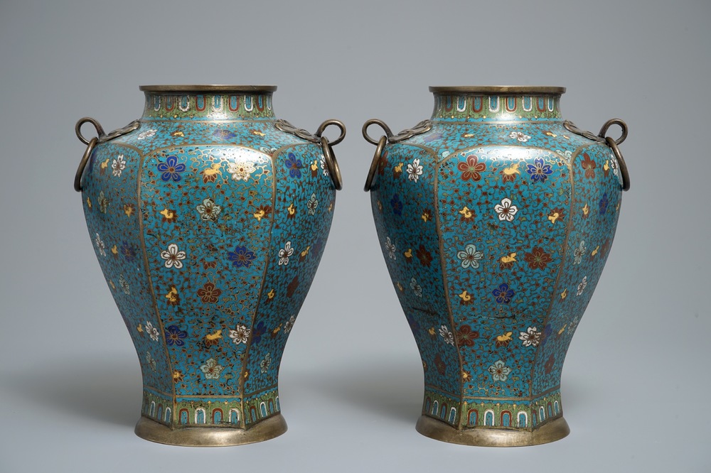 A pair of Chinese cloisonn&eacute; vases with floral design and ring handles, 19th C.