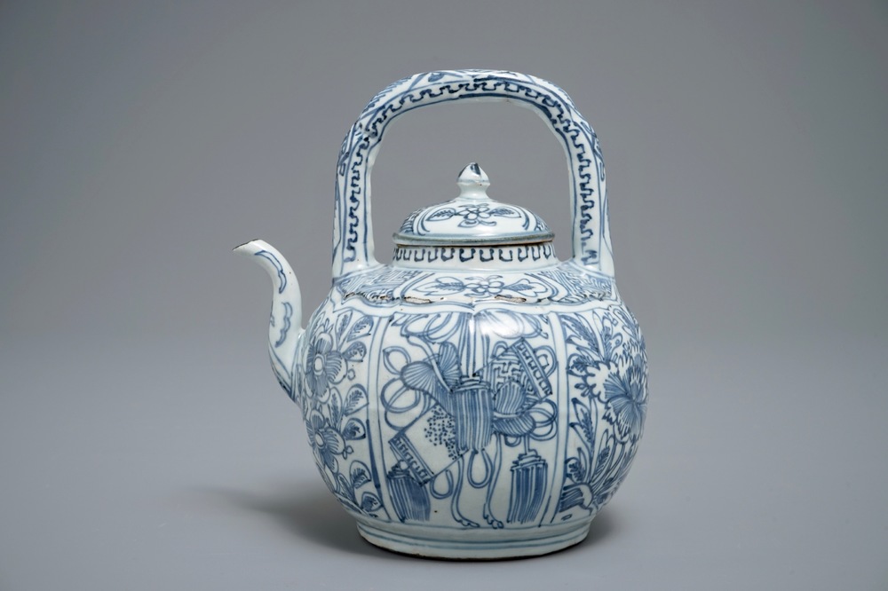 A Chinese blue and white kraak porcelain wine jug and cover with precious objects and flowers, Wanli