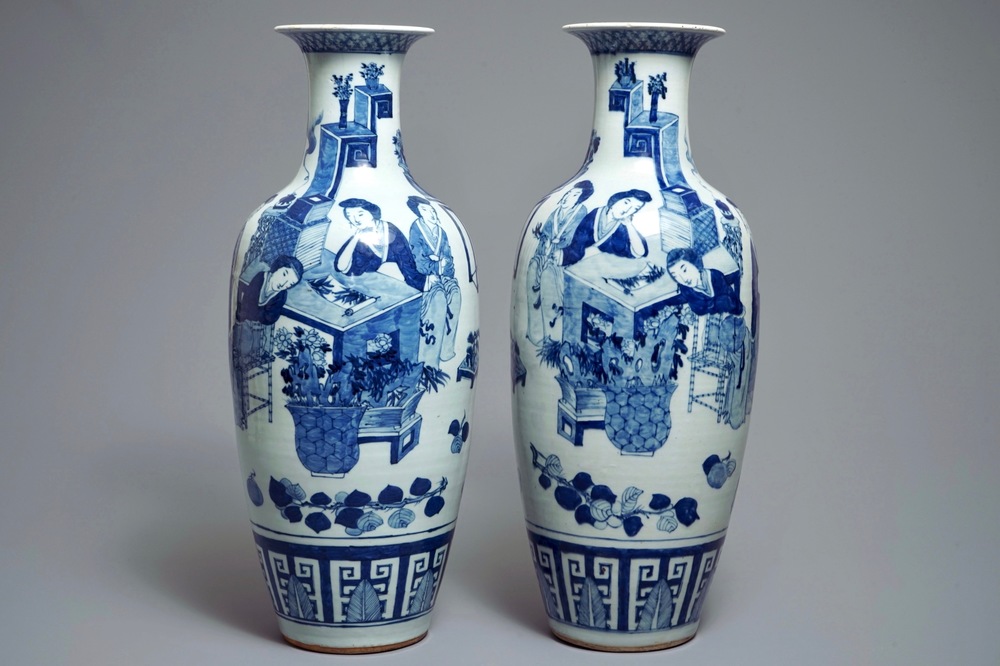 A pair of Chinese blue and white vases with ladies at a table, 19th C.