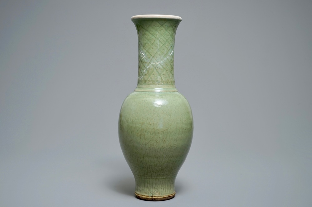 A tall Chinese Longquan celadon vase with underglaze design, Song or Ming