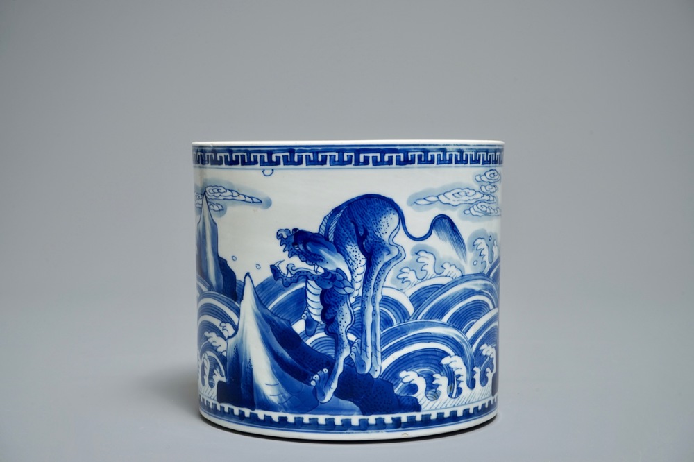 A Chinese blue and white cylindrical brush pot or bitong with mythical beasts, Kangxi