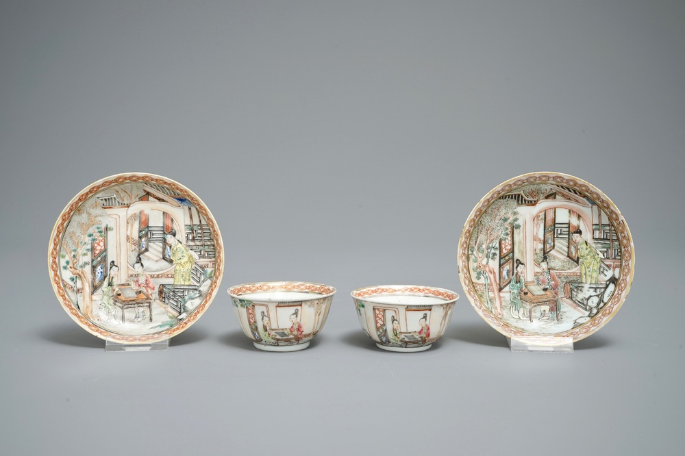 A pair of fine Chinese famille rose cups and saucers with figures in a garden, Yongzheng/Qianlong