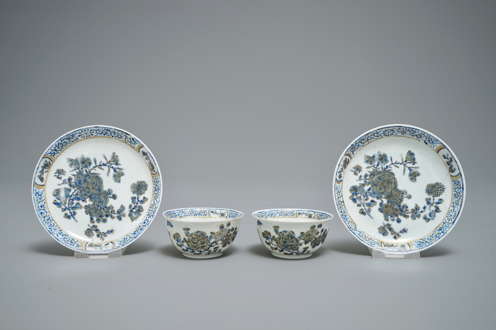 A pair of Chinese eggshell cups and saucers with overglaze blue and gilt floral design, Yongzheng