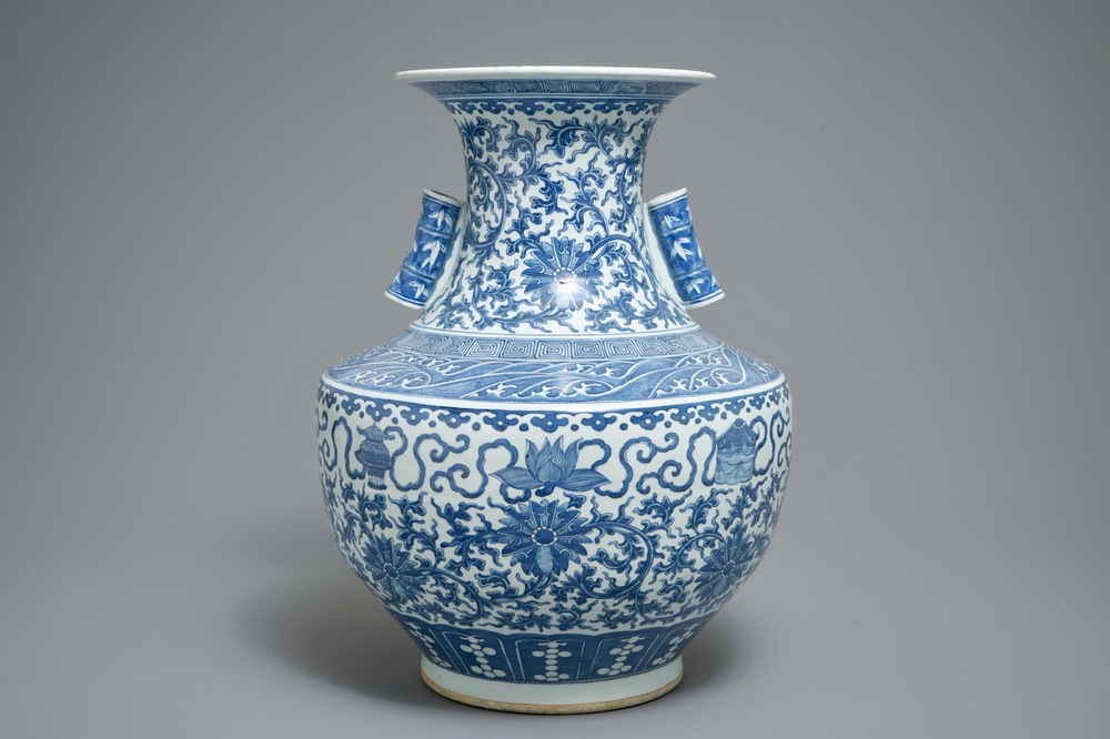 A Chinese blue and white lotus scroll hu vase, 19th C.