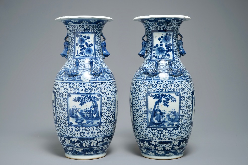 A pair of Chinese blue and white vases with figurative medallions, 19th C.