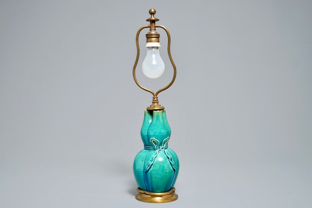 A Chinese turquoise-glazed three-spouted vase with bronze lamp mounts, 19th C.