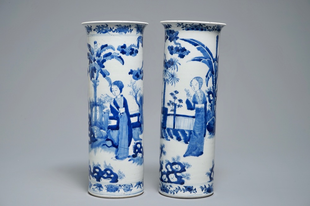 Two Chinese blue and white sleeve vases with ladies in a garden, 19th C.
