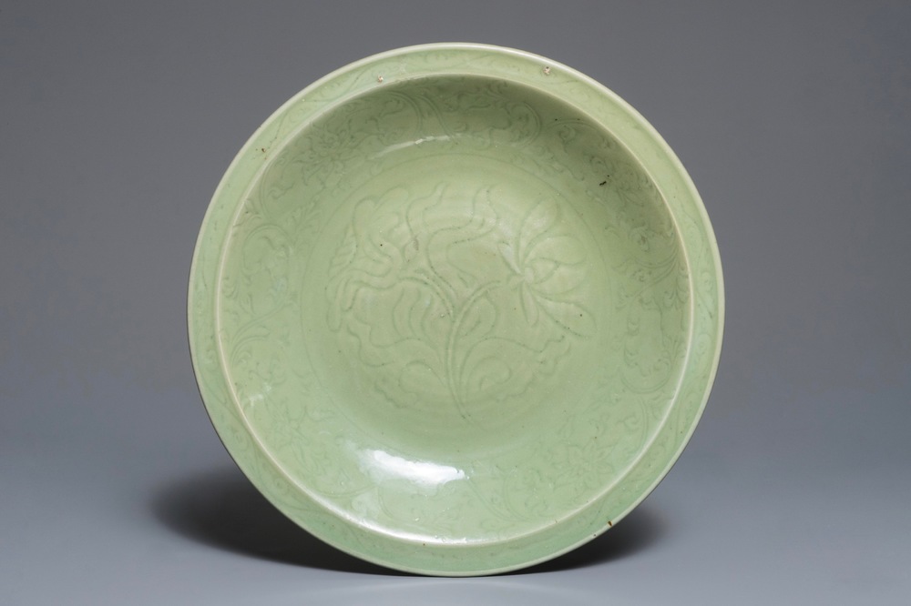 A Chinese Longquan celadon charger with underglaze floral design, Ming